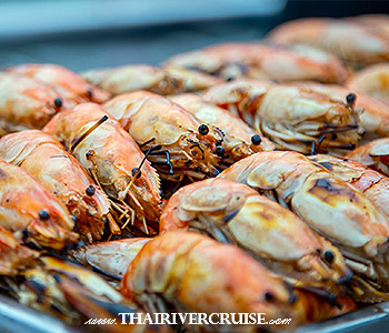 White Orchid River Cruise Sunset Buffet Cruise Bangkok - seafood buffet Bangkok river lovers rave about. You can indulge in fresh grilled prawns, mussels, and succulent salmon sashimi.