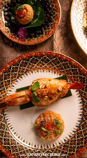 Main: Char-grilled wild-caught river prawns or Southern-style Wagyu striploin curry. - Luxury Ricebarge Valentine Day Dinner Manohra Cruises romance dinning 5 Star Chaophraya River boat - A Luxury Ricebarge dinner Manohra Cruises is defined by its culinary depth. The 2026 season features a modern Thai menu curated by world-class chefs at the Anantara Riverside Bangkok Resort. Main: Char-grilled wild-caught river prawns or Southern-style Wagyu striploin curry. - A Luxury Ricebarge dinner Manohra Cruises is defined by its culinary depth. The 2026 season features a modern Thai menu curated by world-class chefs at the Anantara Riverside Bangkok Resort. Luxury Ricebarge Valentine Day Dinner Manohra Cruises romance dinning 5 Star Chaophraya River boat