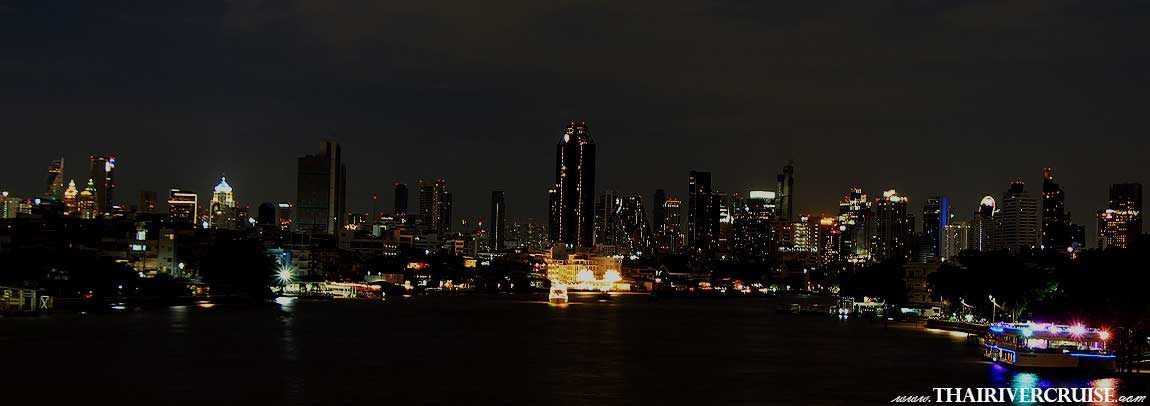 Bangkok night view along the Chaophraya river - Bangkok's Chao Phraya River offers a dazzling night view, especially from dinner cruises or the hop-on-hop-off boats, showcasing illuminated landmarks